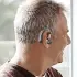 gray haired man with AmpliHear